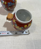 Pair of Red Ceramic Asian Catchalls With Wooden Handles