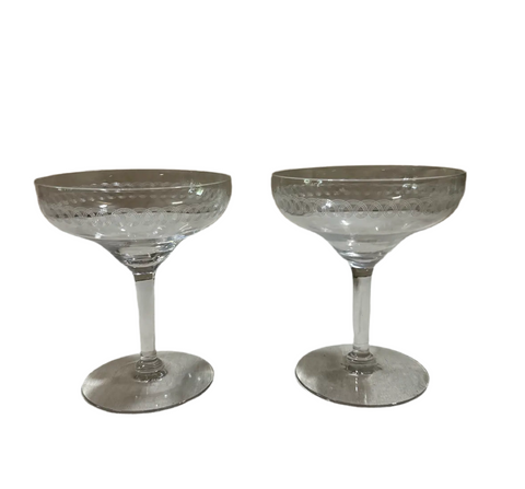 Pair of Champagne Glasses With Etched Designs on Rim