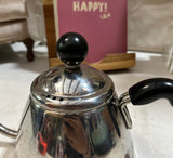 Small Silver Tea Kettle With Black Handles