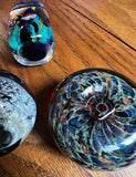 Trio of Dark Blue and Green Glass Paperweights