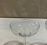 Pair of Champagne Glasses With Etched Designs on Rim