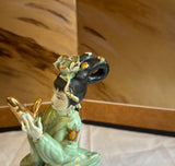 Small Detailed Ceramic Asian Figurine With Gold Accents