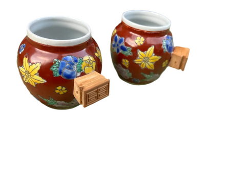 Pair of Red Ceramic Asian Catchalls With Wooden Handles