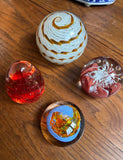 Collection of Orange and Red Glass Paperweights- Set of 4