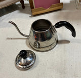 Small Silver Tea Kettle With Black Handles
