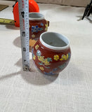 Pair of Red Ceramic Asian Catchalls With Wooden Handles