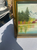 Gold and Green Framed Riverside Painting With Colorful Foliage and Mountains