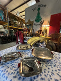 Collection of Four Nesting Bake Light, Silver MCM Footed Trays