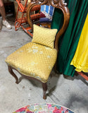 Mid Century Modern Wooden Carved Chair With Yellow Cushions and Attached Pillow