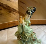 Small Detailed Ceramic Asian Figurine With Gold Accents