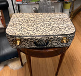 Animal Print Suitcase With Gold Accents