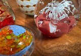 Collection of Orange and Red Glass Paperweights- Set of 4