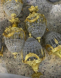 Pair of Crystal and Gold, Bow and Garland Pendant Chandeliers