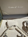 Cote D Azue Collection of Pearl Necklace, Earrings, and Watch