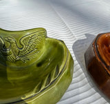 Pair of Ceramic Green and Brown Catchalls With Eagle Accents
