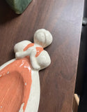Small Ceramic Pink and White Figurine of Woman in Apron
