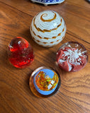 Collection of Orange and Red Glass Paperweights- Set of 4
