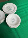Collection of Small Plates and Bowls With Different Flower Designs