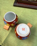 Pair of Red Ceramic Asian Catchalls With Wooden Handles