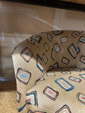 Pair of Fun Design Covered Tan Chairs on Wheels- Missing 1 Wheel