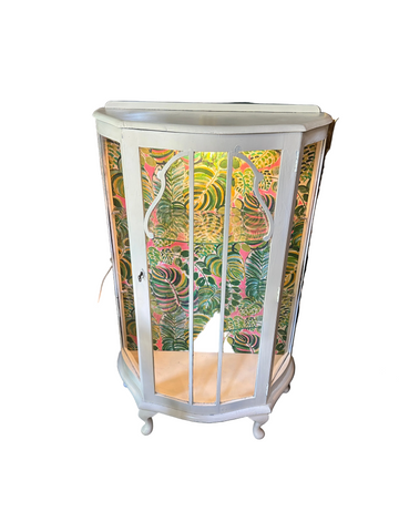 Vintage White Wooden Short Light Up Glass Display Cabinet With Tropical Wallpaper Background