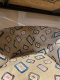 Pair of Fun Design Covered Tan Chairs on Wheels- Missing 1 Wheel