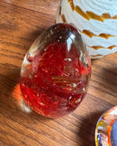 Collection of Orange and Red Glass Paperweights- Set of 4
