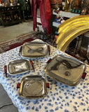 Collection of Four Nesting Bake Light, Silver MCM Footed Trays