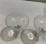 Pair of Champagne Glasses With Etched Designs on Rim