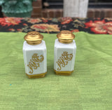 Pair of Ceramic Salt and Pepper Shakers With Gold Accents