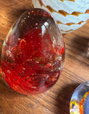 Collection of Orange and Red Glass Paperweights- Set of 4