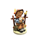 Small Ceramic Sculpture of Boy Picking Petals