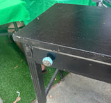 Simple Black Vintage Desk on Wheels With Turquoise and Silver Knobs