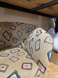 Pair of Fun Design Covered Tan Chairs on Wheels- Missing 1 Wheel