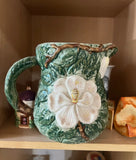 1970s Mid-Century Ceramic Green Pitcher With White Flower Accents