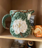 1970s Mid-Century Ceramic Green Pitcher With White Flower Accents