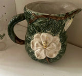 1970s Mid-Century Ceramic Green Pitcher With White Flower Accents
