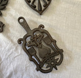 1970s Set of Cast Iron Trivets With Different Designs