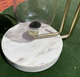Brass Hourglass on a Marble Slab